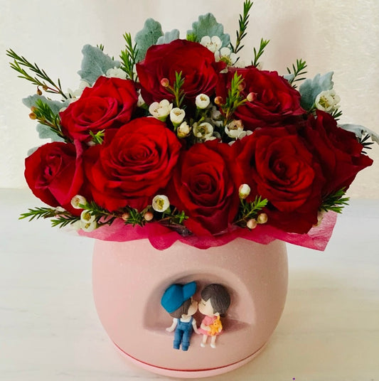 Valentine Red Bouquet With Pot & Figurine with 8 Roses _Caidra by Rubyxx Gifting 